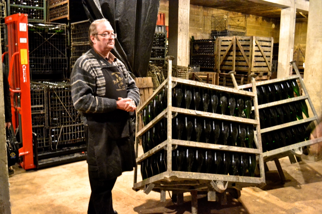 Michael Caine showing us the riddling cages that (unlike the wooden racks) cut down on the manual turning and tilting time. Still pretty old school.